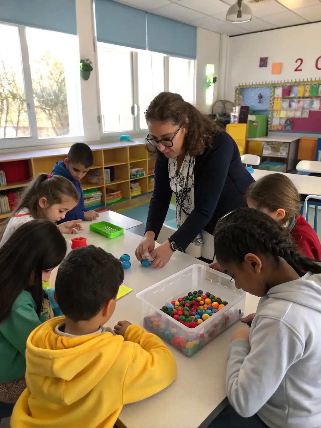 A group of elementary students working on a science experiment together in a bright, well-equipped classroom at Education For Learners.